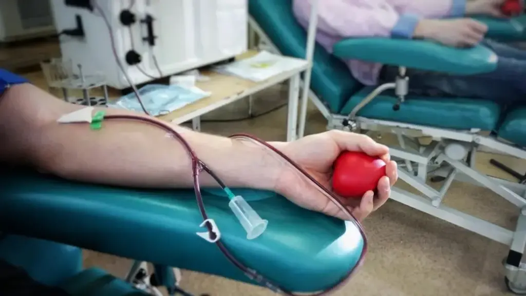 close up of an arm having a blood transfusion large